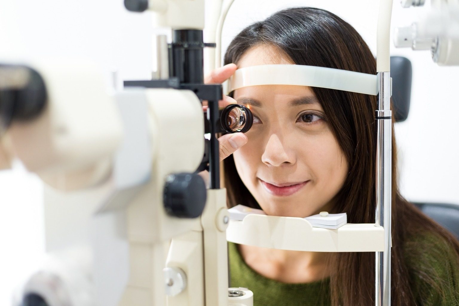 Patient at a slit lamp during an eye exam